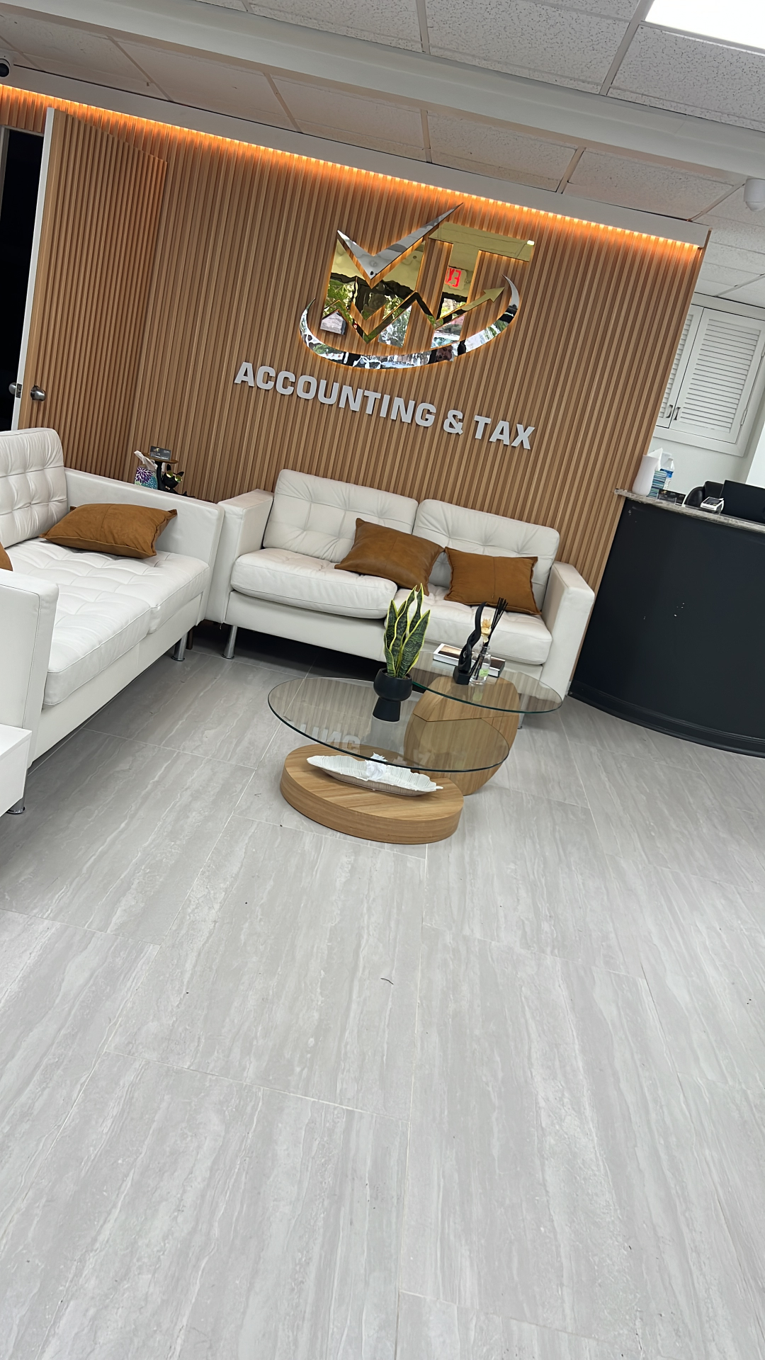 MT Group Memphis reception area with branded gold wall